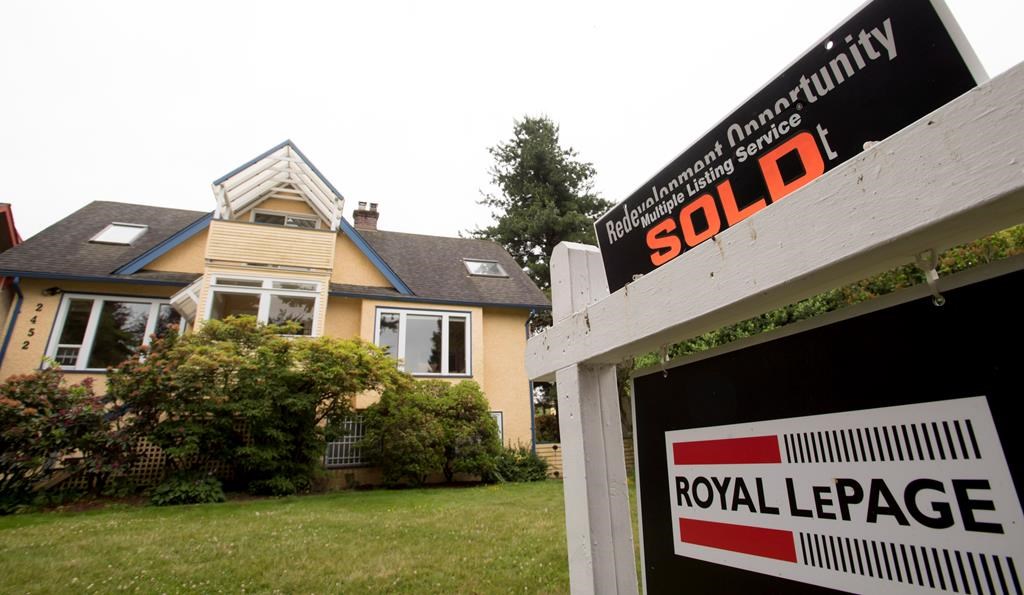 A real estate sign is pictured in Vancouver, B.C., Tuesday, June, 12, 2018. Housing assessments in British Columbia show the real estate market continues to see signs of moderation in the Lower Mainland while stabilizing on Vancouver Island and other parts of the province.