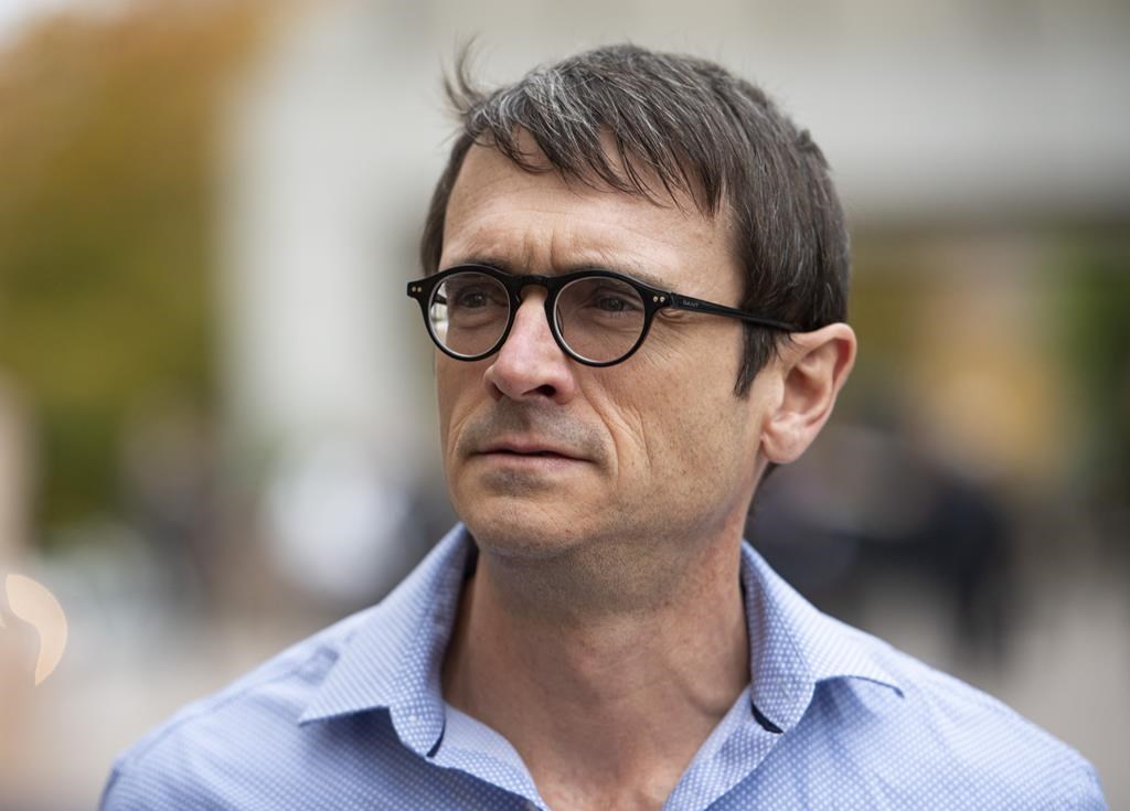 Cameron Ortis, a senior intelligence official at the RCMP, leaves the courthouse in Ottawa after being granted bail, Tuesday, Oct. 22, 2019. The federal prosecution service says Ortis a senior RCMP official, faces three new charges for alleged secrecy breaches.