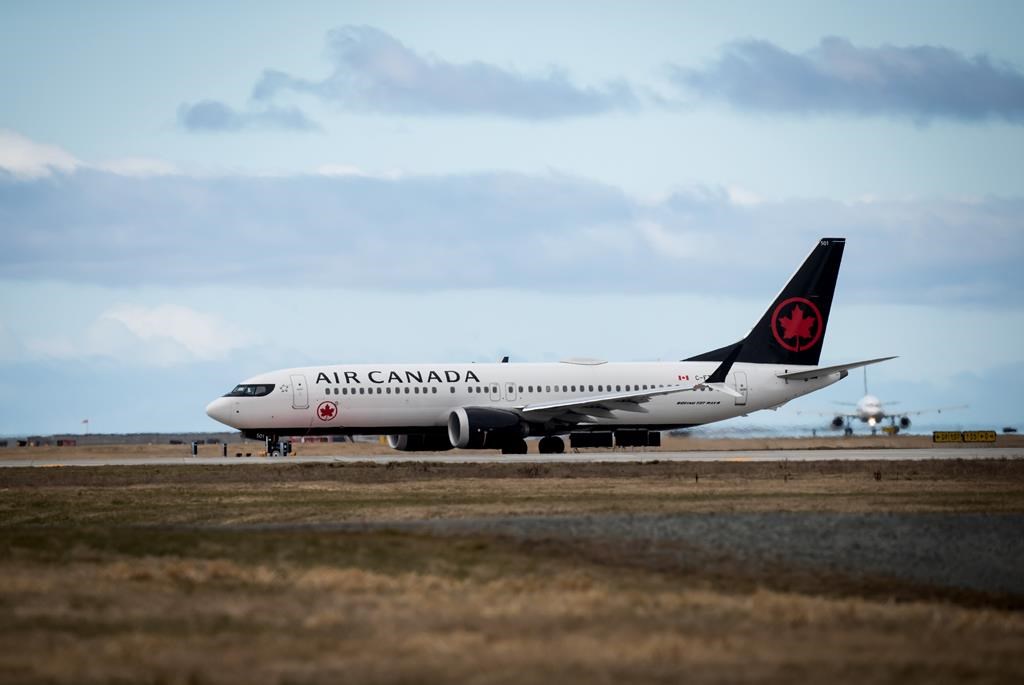 An Air Canada Boeing 737 aircraft departing for Calgary taxis to a runway at Vancouver International Airport in Richmond, B.C., on Tuesday, March 12, 2019.