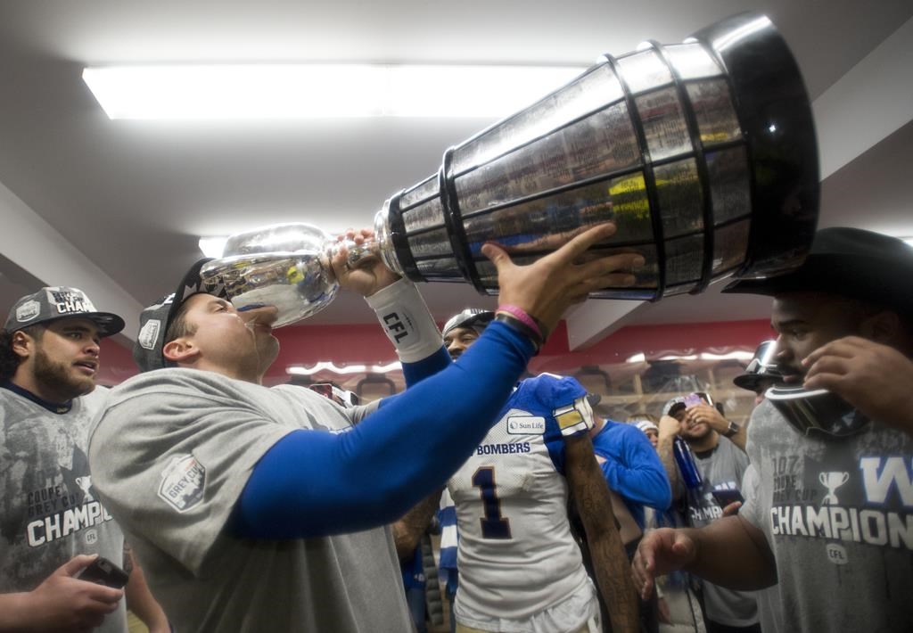 Winnipeg Blue Bombers quarterback Zach Collaros drinks from the Cup as they celebrate winning the 107th Grey Cup. The team will unveil their Grey Cup rings Thursday.
