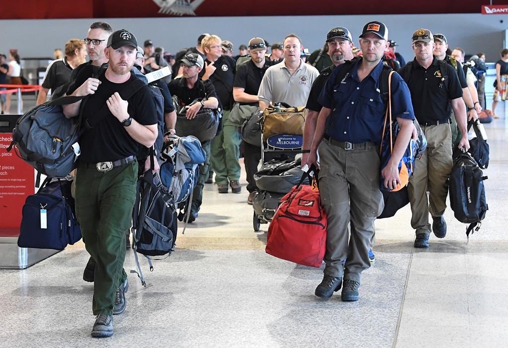 A contingent of 39 firefighters from the United States and Canada arrive at Melbourne Airport in Melbourne, Thursday, January 2, 2020. Another 69 Canadians are heading to Australia this week to help fight the country's worst bushfires in recent memory. Foreign Affairs Minister Francois-Philippe Champagne says on Twitter the deployment comes after Australia requested more help.