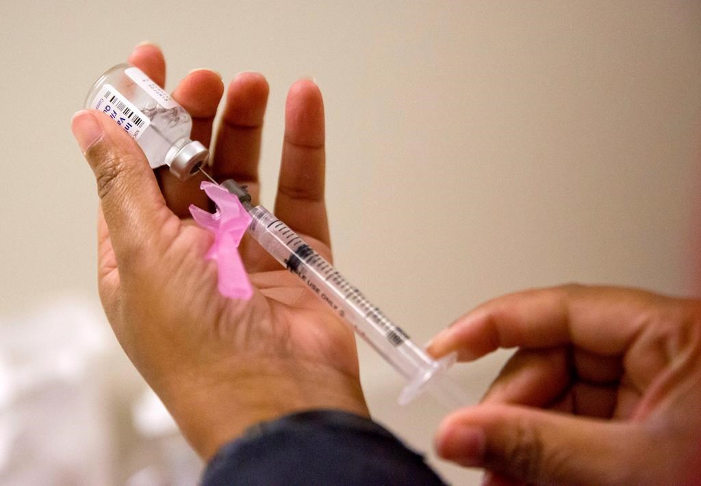 A nurse prepares a flu shot at the Salvation Army in Atlanta, Feb. 7, 2018.