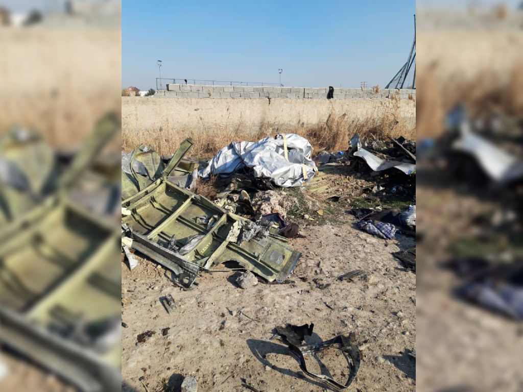 What appears to be one of the aircraft’s doors was part of the rubble.