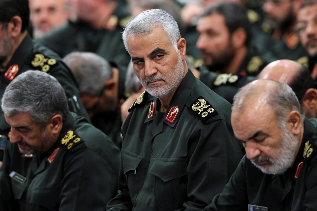 In this Sept. 18, 2016, photo provided by an official website of the office of the Iranian supreme leader, Revolutionary Guard Gen. Qassem Soleimani, centre, attends a meeting in Tehran, Iran.