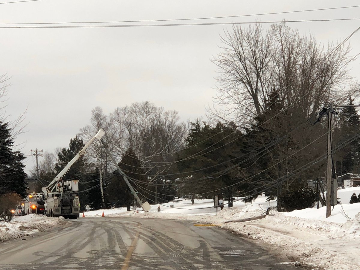 Two poles fell on Vincent Road this morning, causing a power outage in Quispamsis, N.B.