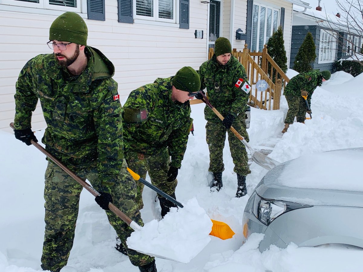 Canadian Armed Forces members in Newfoundland and Labrador on Jan. 20, 2019, after an intense snowstorm ground the province to a halt. 