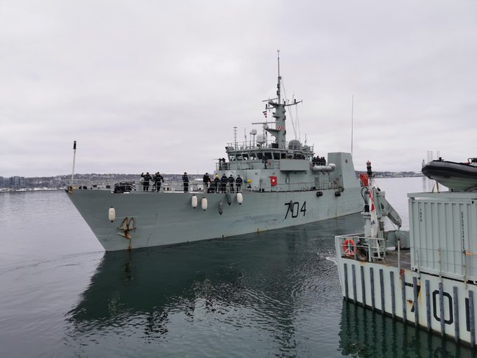 HMCS Shawinigan pulls away from the dockyard in Halifax. 