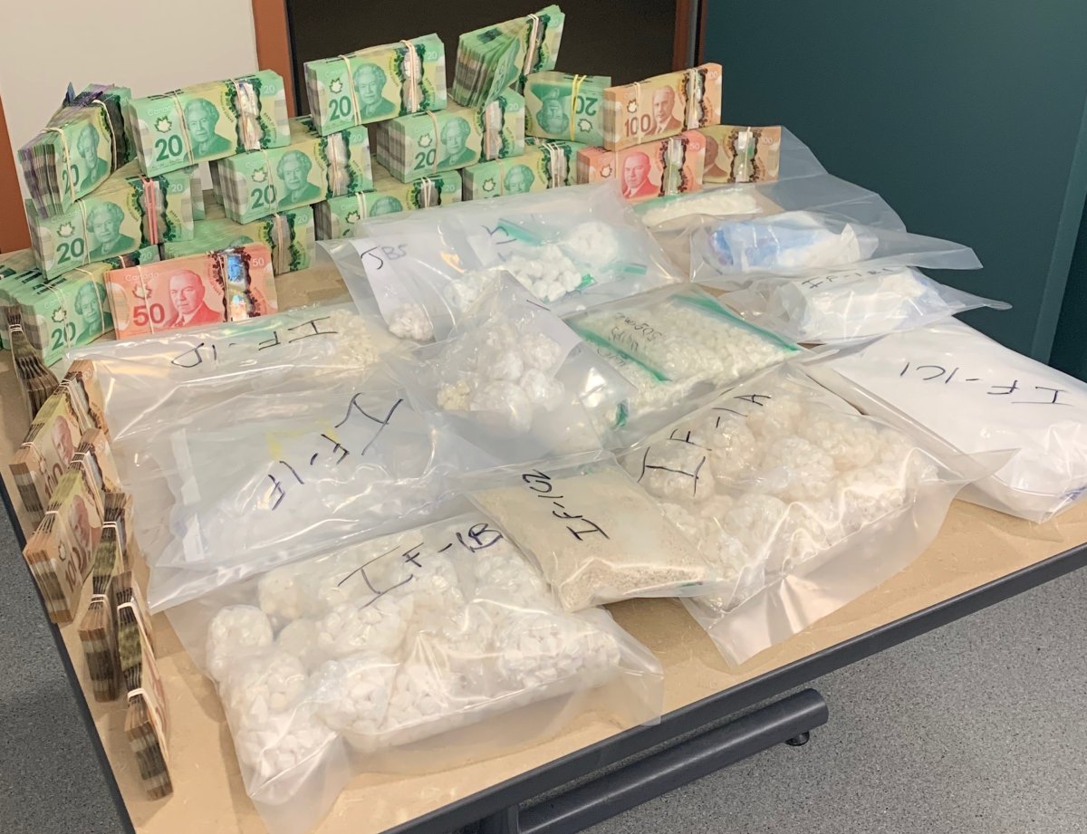 Undated photo from Edmonton police showing the cocaine, meth and money seized from  three homes across north Edmonton on Sunday, Jan. 5, 2019. 
