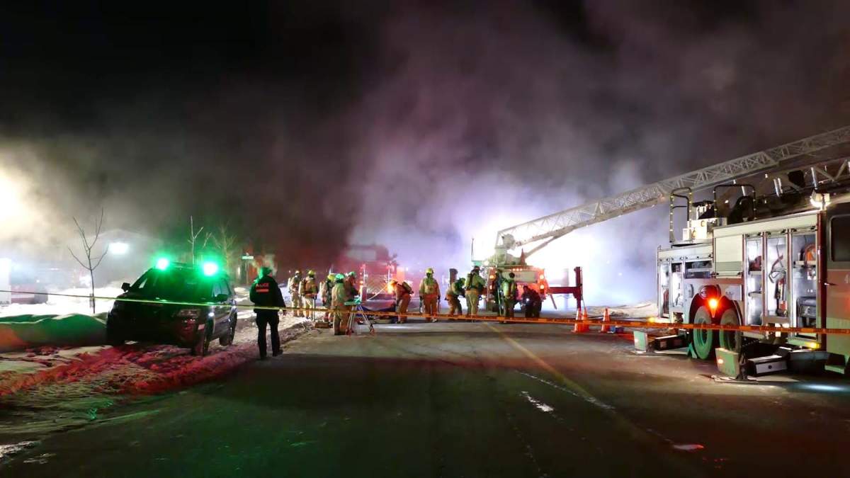 Montreal firefighters attempting to extinguish the blaze at a home on  Westpark bvld. in Pierrefonds. 