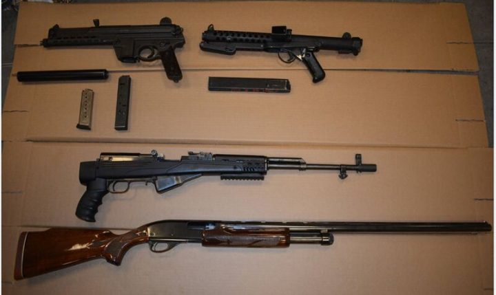 Toronto police released photos allegedly showing weapons that were seized as a search warrant was executed Saturday.