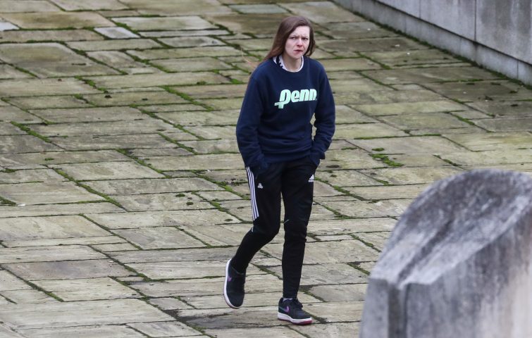 Gemma Watts, a British woman who pleaded guilty for posing as a teenage boy to sexually groom young girls, walks to the Winchester Crown Court in Winchester, Britain, Jan. 10, 2020.