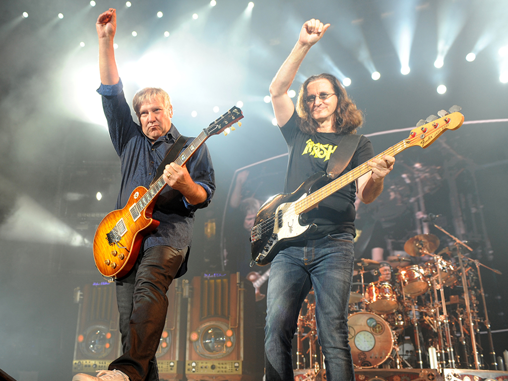 Alex Lifeson, Geddy Lee and Neil Peart of Rush perform on the final night of their North American tour at Cruzan Amphitheatre on Oct. 2, 2010, in West Palm Beach, Fla. (Photo by Larry Marano/Getty Images)