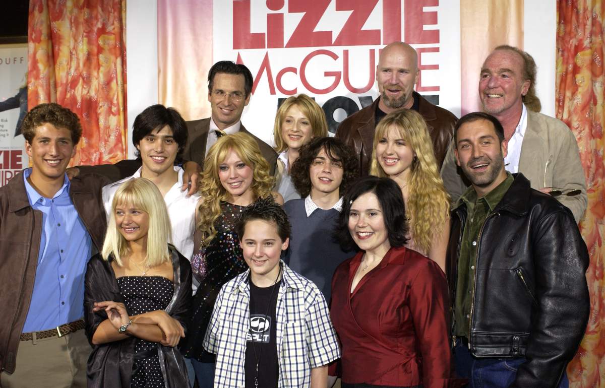 'The Lizzie McGuire Movie' cast with producer Stan Rogow (top far right) and Jim Fall, director (middle far right) .