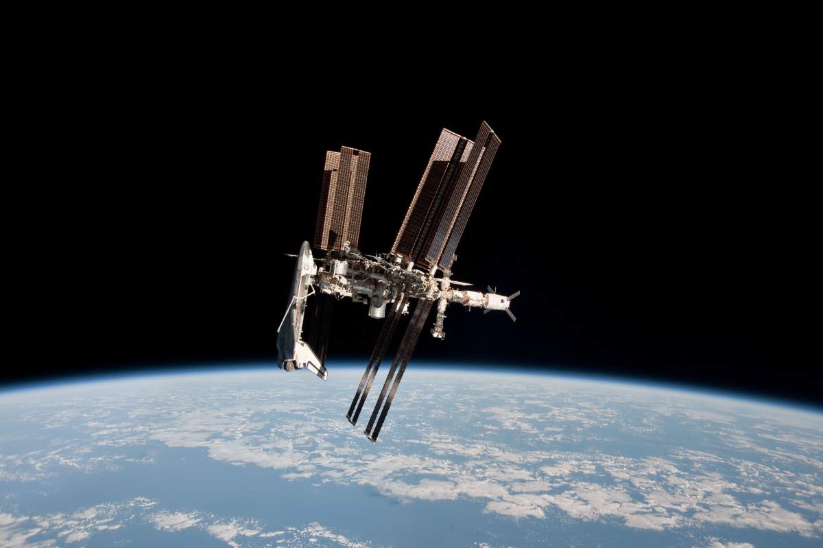 In this handout image provided by the European Space Agency (ESA) and NASA, the International Space Station and the docked space shuttle Endeavour orbit Earth during Endeavour's final sortie on May 23, 2011 in space.  
