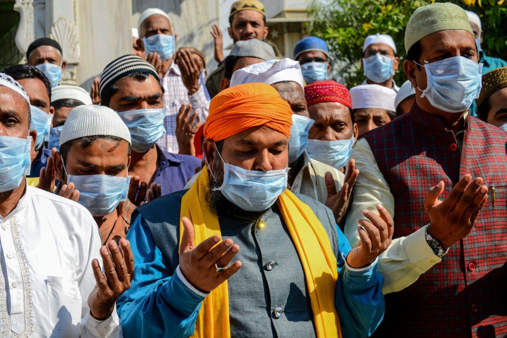 Muslims wearing protective facemasks participate in a special prayer for the well-being and safety of all Indians against the coronavirus outbreak, in Ahmedabad, India on Jan. 31, 2020.