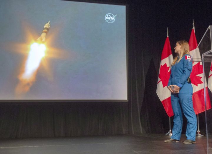 Canadian astronaut Jenni Sidey-Gibbons watches the launch of astronaut David Saint-Jacques for the international space station from Kazakhstan at the Canadian Space Agency headquarters Monday, December 3, 2018 in St. Hubert, Quebec. The two Albertans graduated Friday from NASA's basic astronaut training, making them part of the next generation of space explorers hoping to return to Earth's satellite and beyond.
