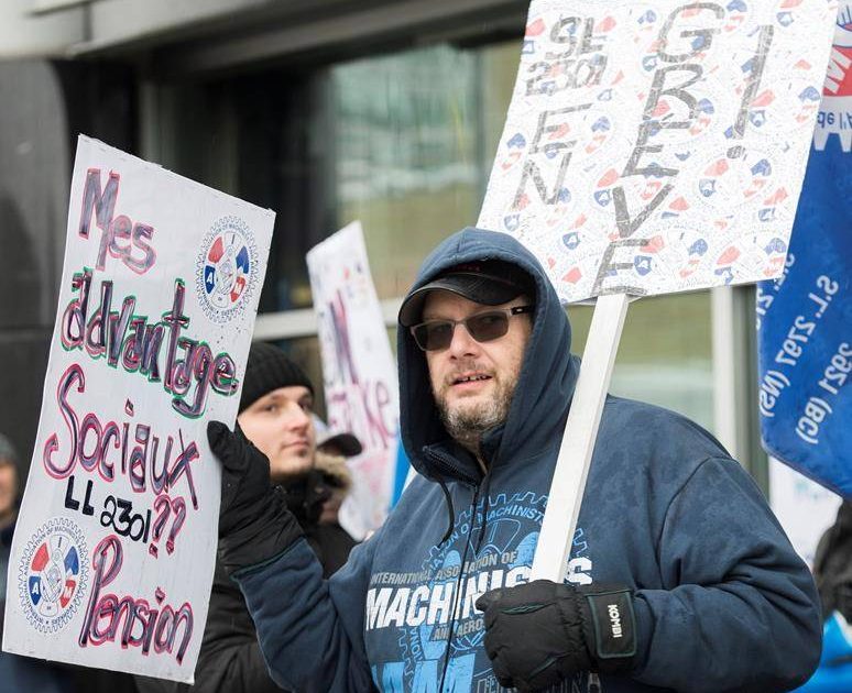 Swissport employees protest outside Pierre Elliott Trudeau Airport in Montreal, Tuesday, December 31, 2019.