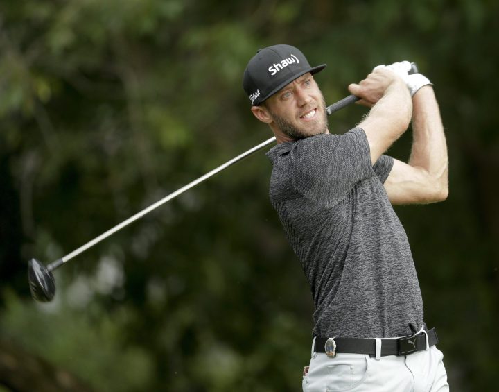 Graham DeLaet watches his tee shot on the fifth hole during the second round of the PGA Championship golf tournament at the Quail Hollow Club Friday, Aug. 11, 2017, in Charlotte, N.C.