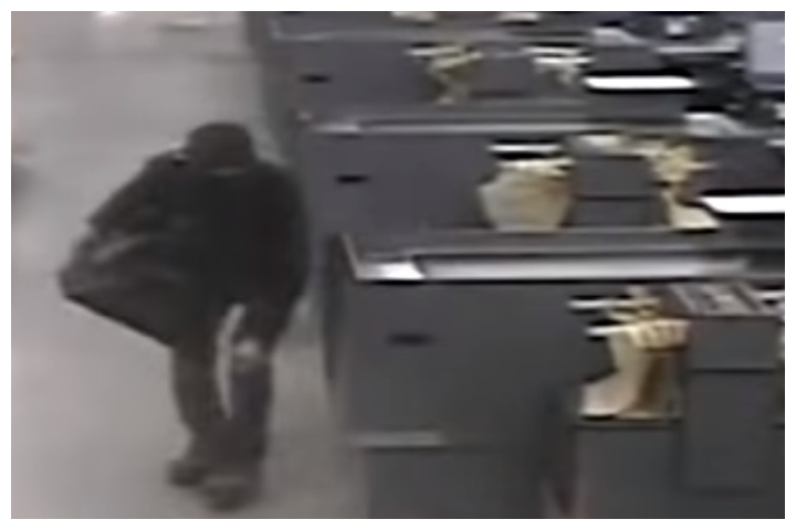 A masked suspect is shown in this image from security footage recorded after closing time at a grocery store in Auburn, Wash., on Dec. 25, 2019.