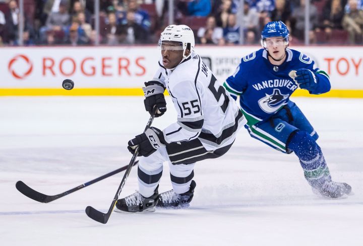 Los Angeles Kings' Bokondji Imama (55) and Vancouver Canucks' Elias Pettersson, of Sweden, watch the puck during the third period of a pre-season NHL hockey game in Vancouver, B.C., on Thursday September 20, 2018. 