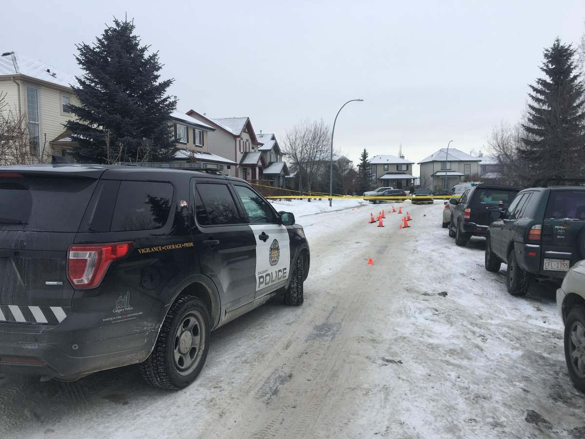 Officers gather evidence at home on Somerside Close S.W. on Sunday, Jan. 12, 2020.