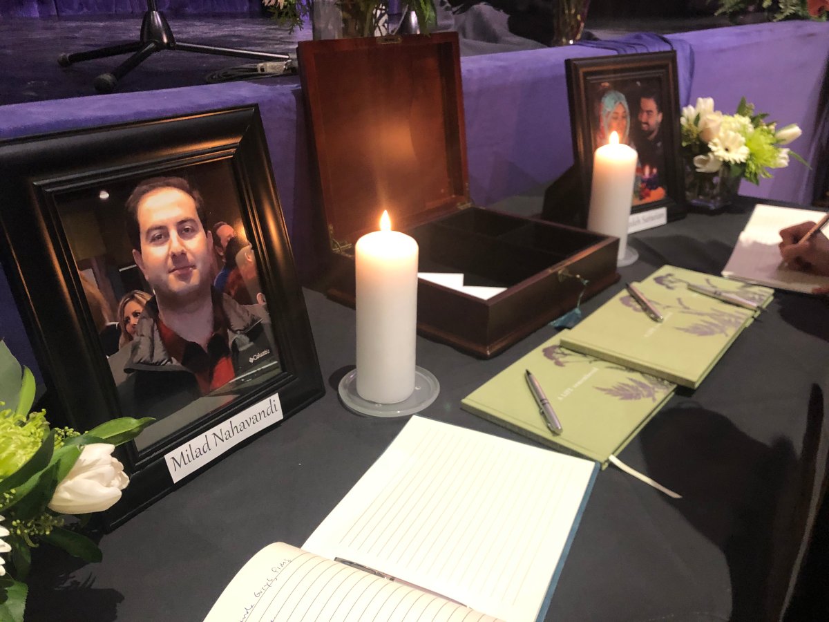 A table for remarks is set up during a vigil at Western University honouring four students killed in in the crash of Ukraine International Airlines Flight 752.