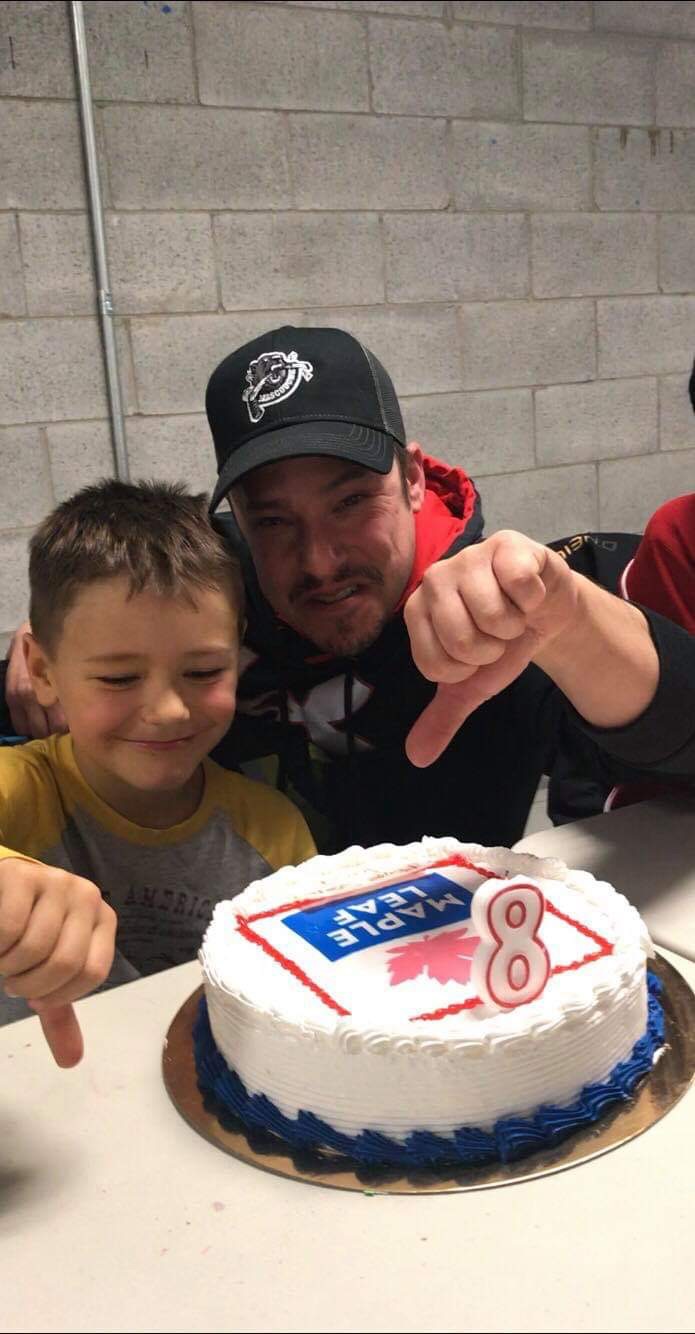 Jacob Bertrand and his father with his birthday cake.
