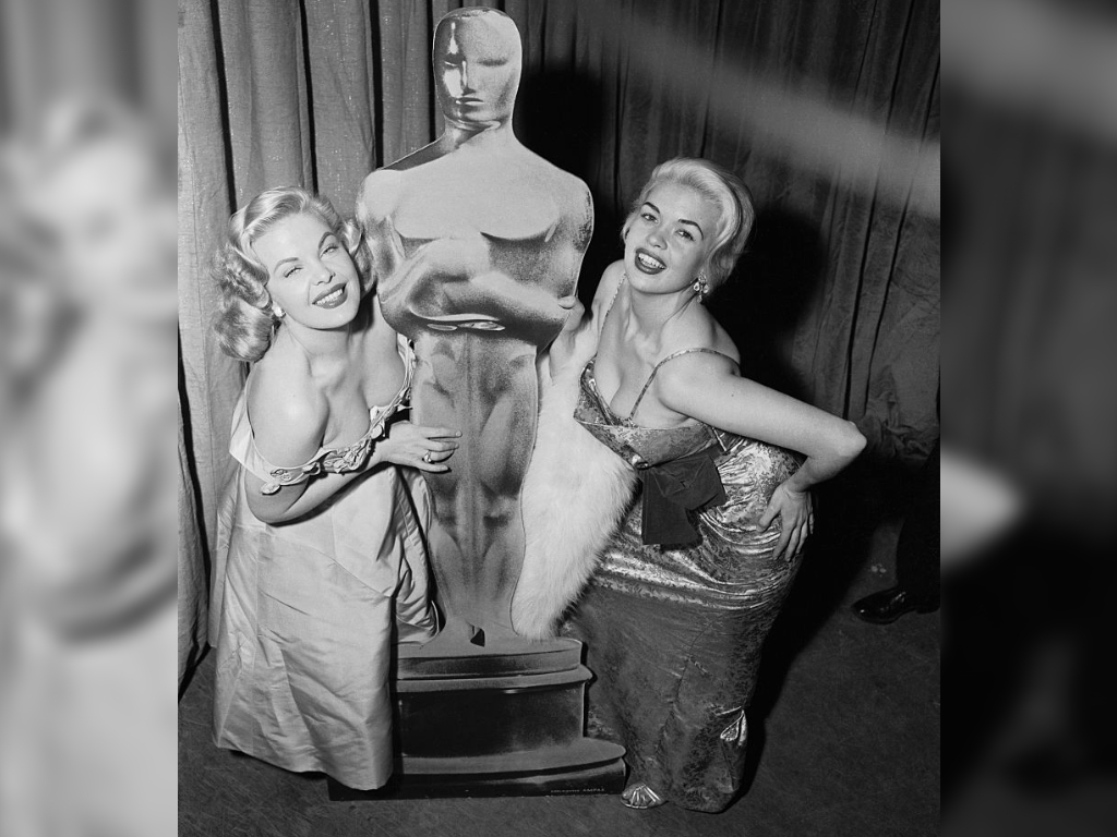 Cleo Moore and Jayne Mansfield pose together at the 28th Oscars.