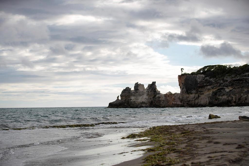 A natural formation known as “Punta Ventana,” or Window Point, stands without the bridge that once created the formation of the window, or a hole, in Guayanilla, Puerto Rico, Monday, Jan. 6, 2020. The natural bridge collapsed during the morning’s earthquake. (AP Photo/Jorge A. Ramirez Portela)