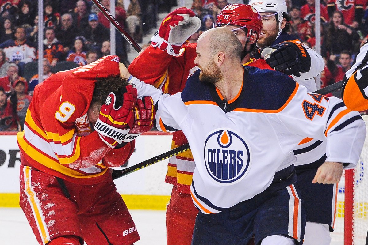 Zack Kassian #44 of the Edmonton Oilers fights Matthew Tkachuk #19 of the Calgary Flames during an NHL game at Scotiabank Saddledome on January 11, 2020 in Calgary, Alberta, Canada. 