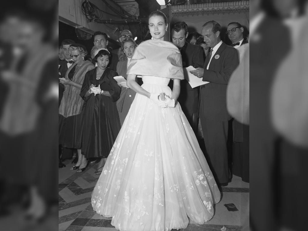 Grace Kelly makes her last public appearance in Hollywood as she attends the 28th annual Academy Award presentations before her wedding to Prince Rainier.