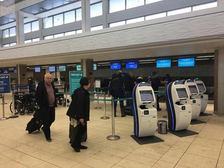 Passengers at Kelowna International Airport on Wednesday.