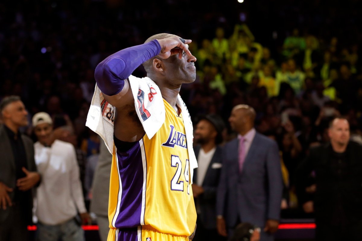 Los Angeles Lakers' Kobe Bryant acknowledges fans after the last NBA basketball game of his career against the Utah Jazz in Los Angeles on April 13, 2016.