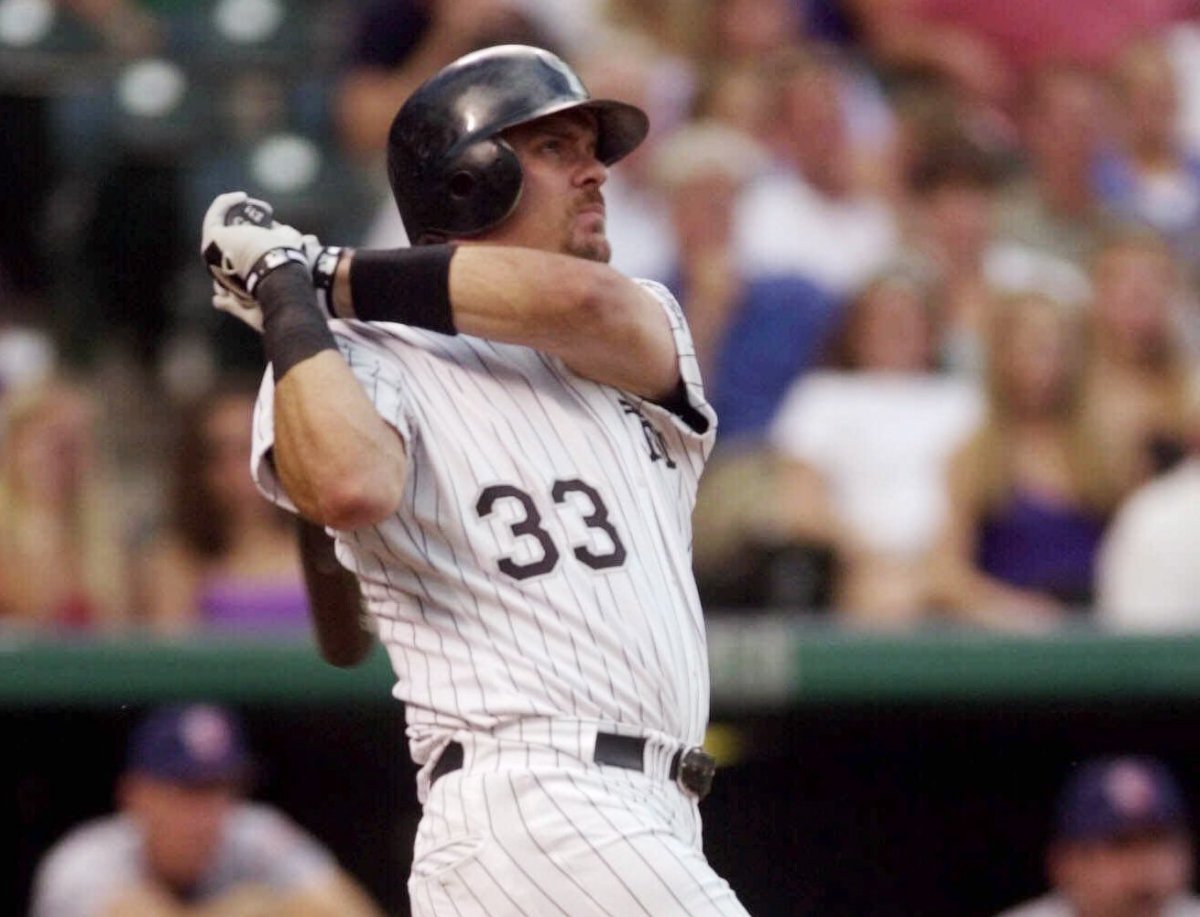 Colorado Rockies' Larry Walker, of Maple Ridge, B.C. watches the flight of his two-run home run on a pitch from San Diego Padres starting pitcher Kevin Jarvis in the third inning in Denver's Coors Field on Monday, June 25, 2001.
