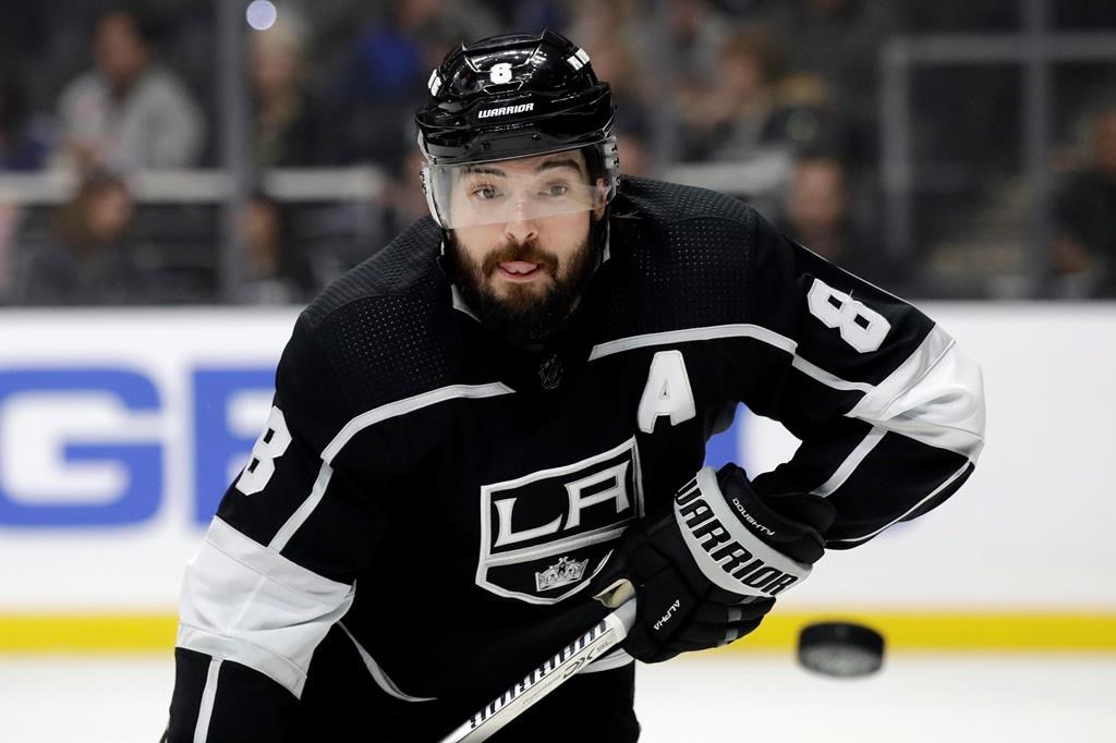 Los Angeles Kings' Drew Doughty (8) eyes the puck after a faceoff during the first period of the team's NHL hockey game against the Philadelphia Flyers on Tuesday, Dec. 31, 2019, in Los Angeles.