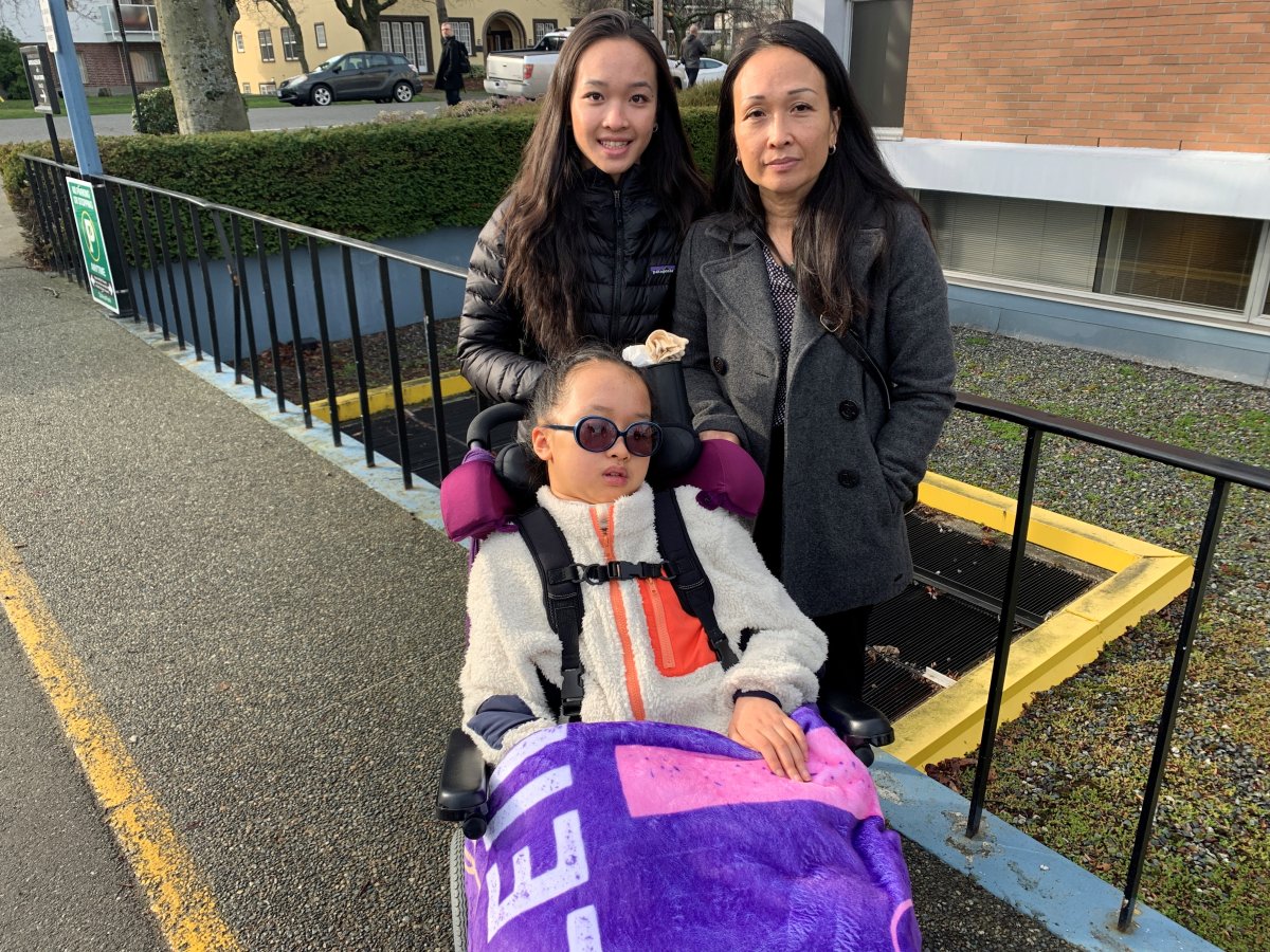Leila Bui pictured in a wheelchair, along with her mother Kairry and her sister.