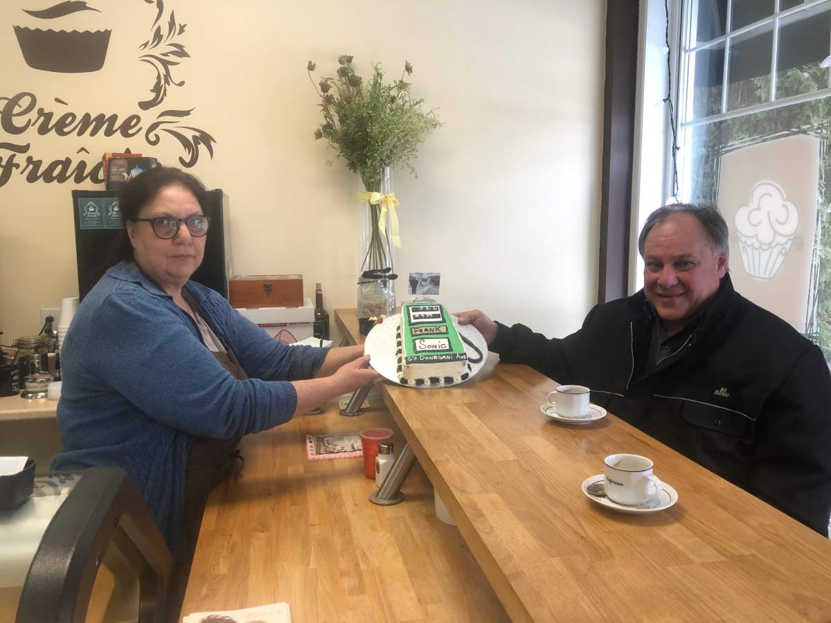 Lina Caruso shows Frank Mancuso the cake she's auctioning off for him. Jan 21, 2020.