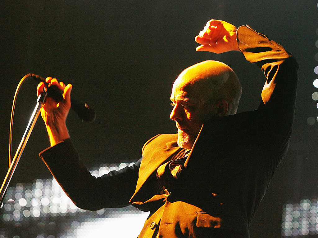 REM and Michael Stipe perform on stage in England.