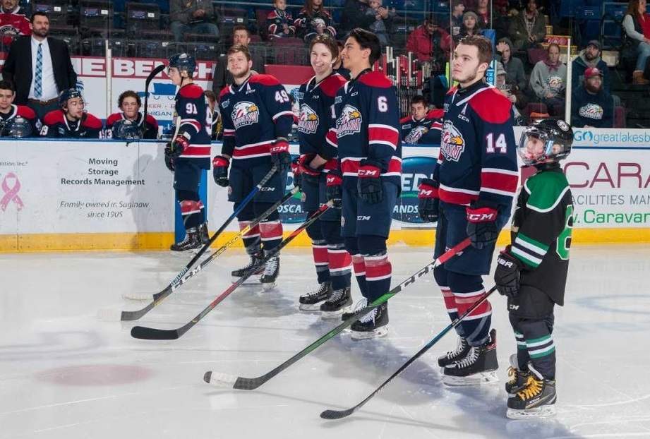 Mason Millman and Ryan Suzuki share a moment prior to puck drop.