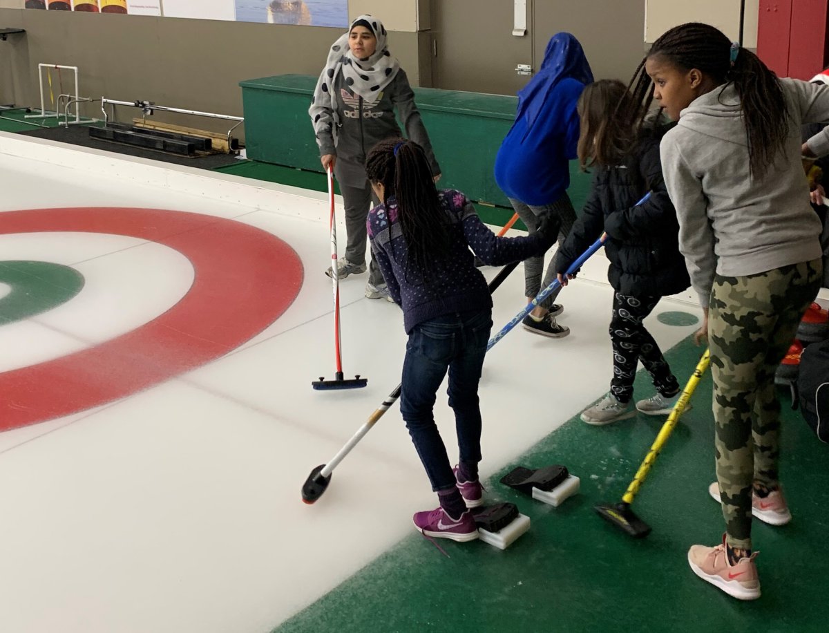 Children take part in a Manitoba program that introduces new Canadians to curling at the Granite Curling Club in Winnipeg on Jan. 4, 2020 in a handout photo. 