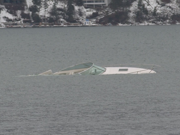 Rescue crews were called to a partially submerged boat in Okanagan Lake on Wednesday afternoon.
