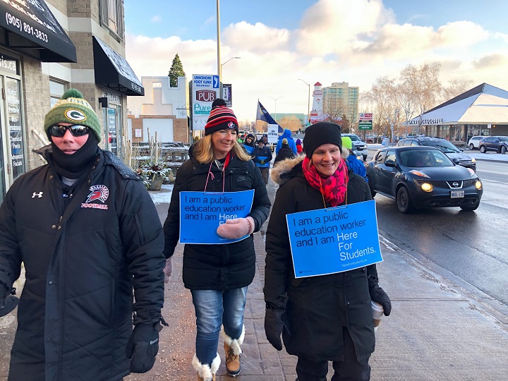 Ontario's high school teachers and educational workers from eight school boards on strike for one day. Picketers strike in Mississauga.