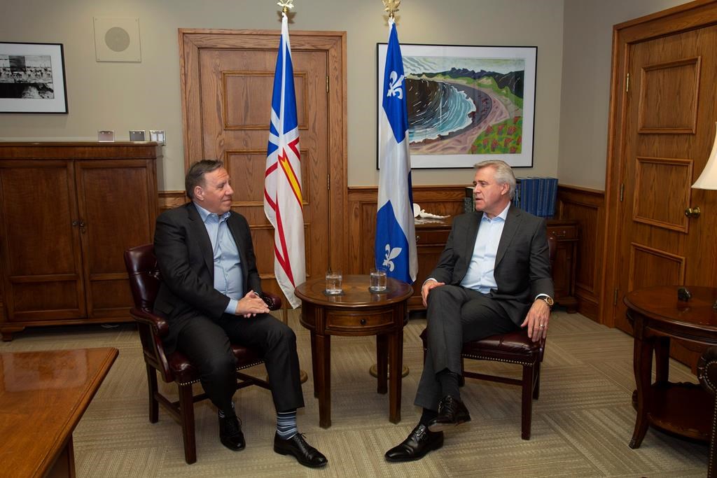 Quebec Premier Francois Legault, left, and Newfoundland and Labrador Premier Dwight Ball sit for a meeting ahead of the Atlantic Premiers' conference, at the Confederation Building in St. John's, Sunday, Jan. 12, 2020. THE CANADIAN PRESS/Paul Daly.