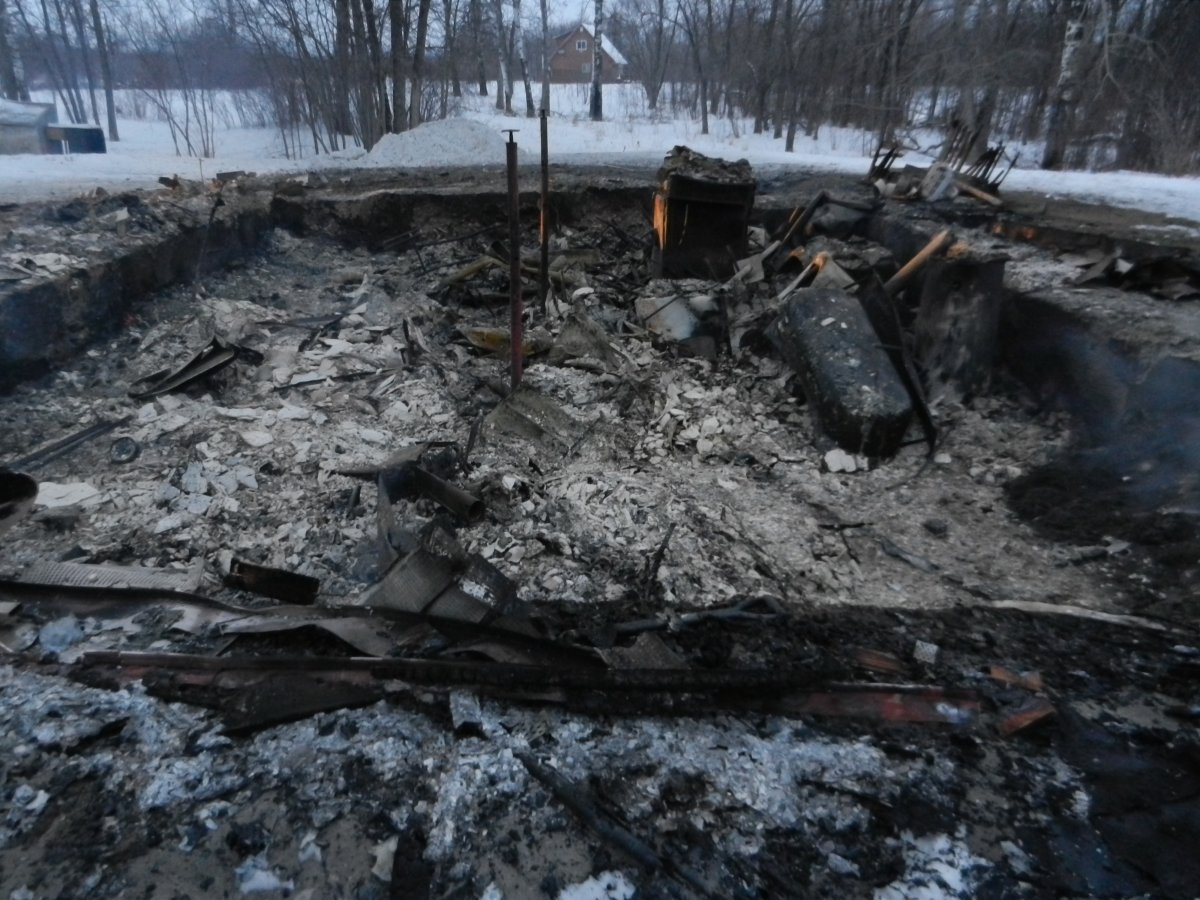 Arson charges have been laid in connection with a fire that destroyed a home on Peguis First Nation Friday.