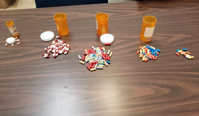 Guelph police say over $4,000 in pills and cash were seized on Thursday. 