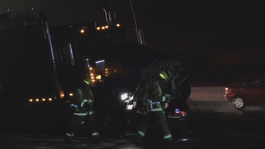 Firefighters respond to a two-vehicle collision on the Queen Elizabeth Way in Beamsville Saturday night.