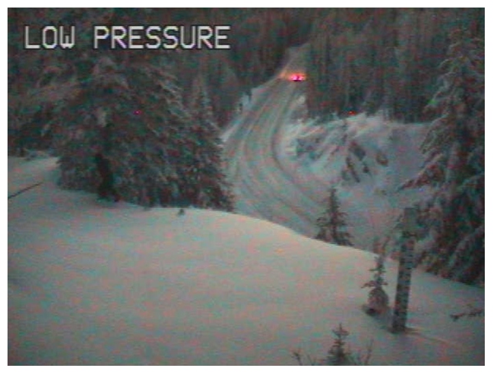 An image captured on a traffic camera shows a dark outline on the left side of the frame.