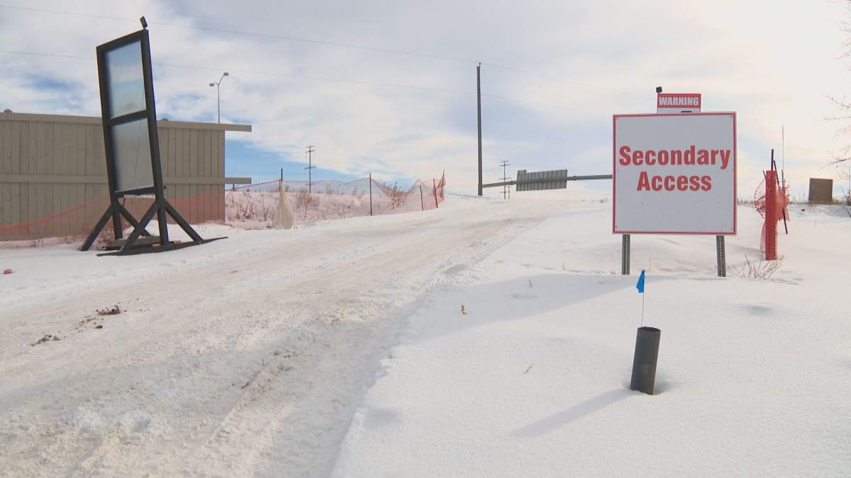 The only other way into the community is a unpaved road.