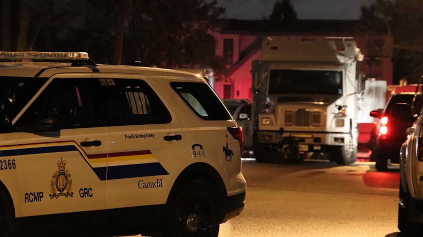 Surrey RCMP and ERT units surround a home after reports of a "loud noise" on Jan. 24, 2020.