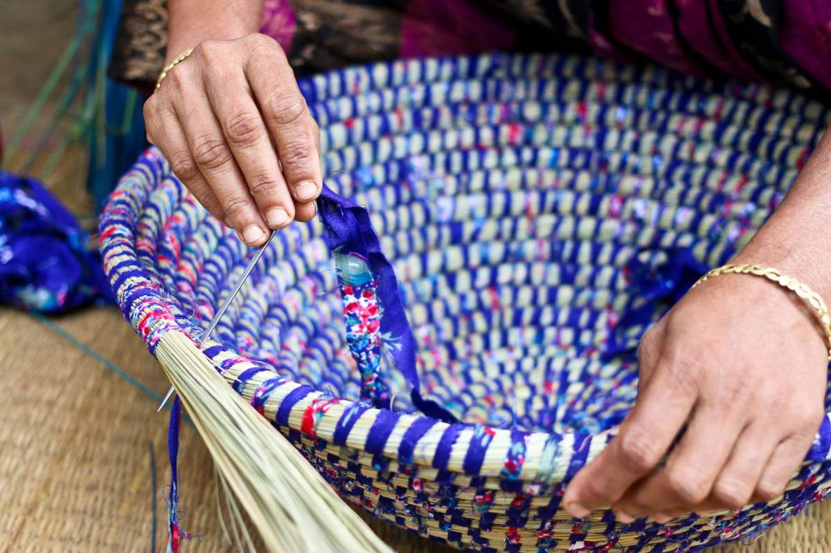 Image shows woven bowl for sale at Canadian Ten Thousand Village store.